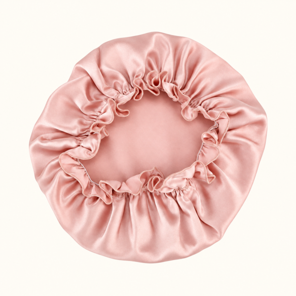 Rear view of a Blush Pink ruffled mulberry silk bonnet
