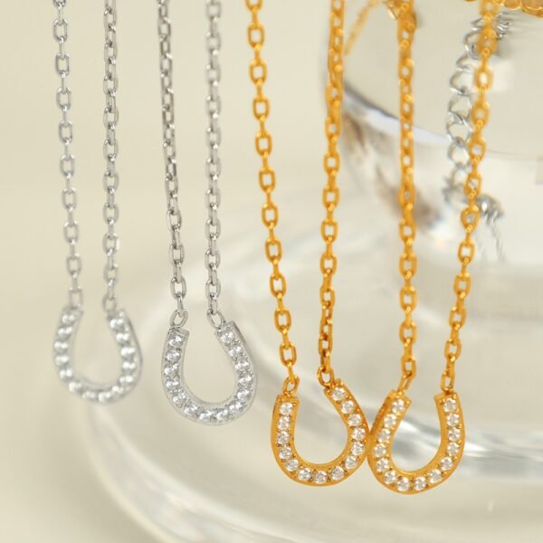 Pavé Horseshoe Pendant Necklace product image 1 Gold-tone pavé horseshoe necklace with 40 cm chain, 5 cm extender and pendant dimensions