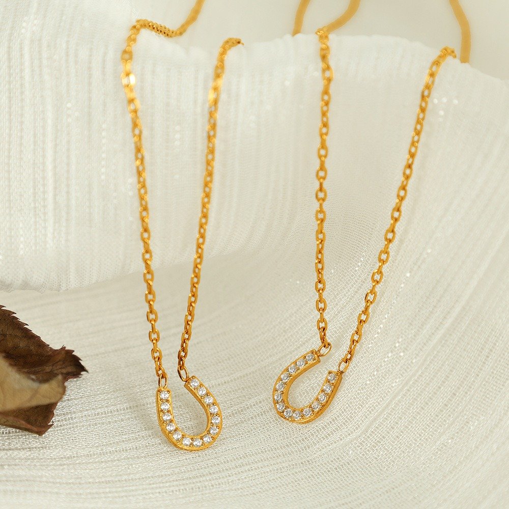 Gold-tone pavé horseshoe pendant necklace