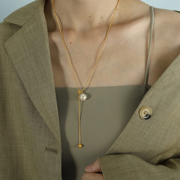 Pearl Drop Adjustable Y Necklace product image 4 Close-up of glass pearl drop and polished stainless steel chain